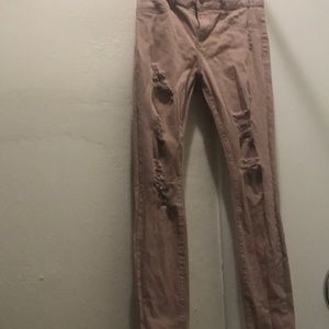 Blush pink ripped jeans